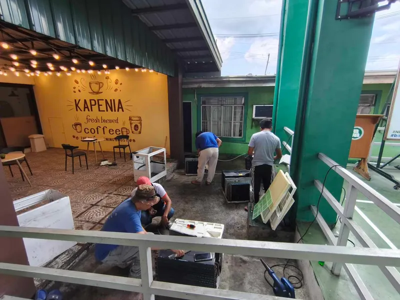 Team servicing units at commercial establishment