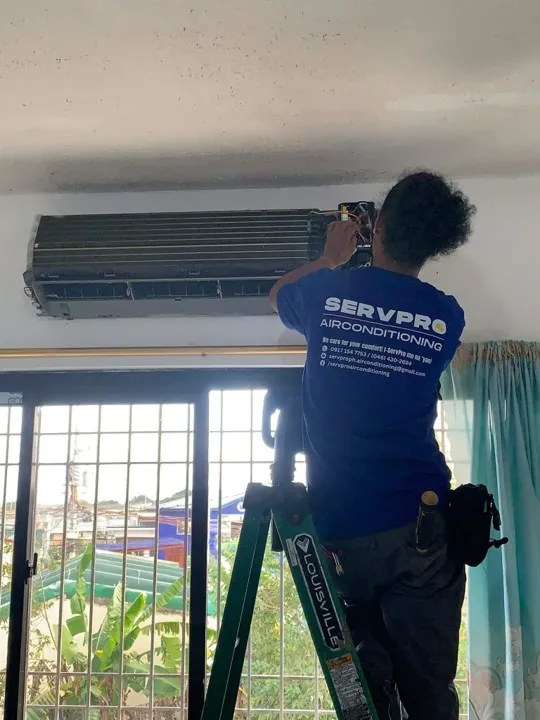 SERVPRO technician servicing indoor split unit