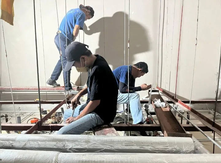 SERVPRO crew installing ceiling-mounted aircon units