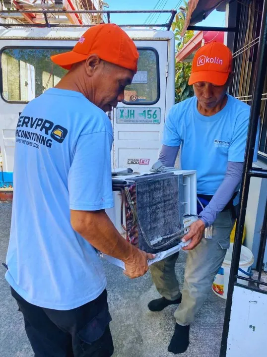 Crew installing ceiling-mounted units